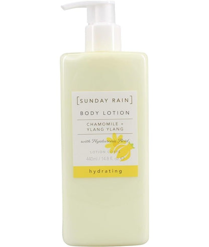 Sunday Rain chamomile and ylang ylang body lotion bottle with floral label and natural ingredients displayed.