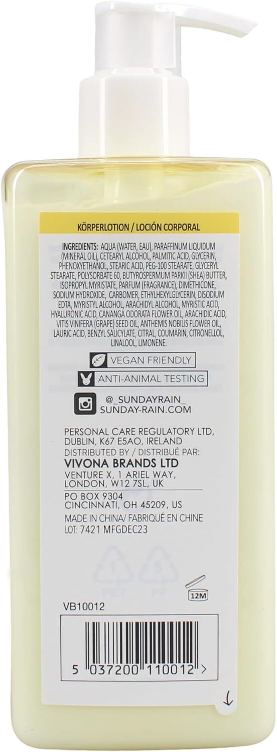Sunday Rain Chamomile and Ylang Ylang body lotion in a pump bottle, with fresh chamomile and ylang ylang flowers nearby.