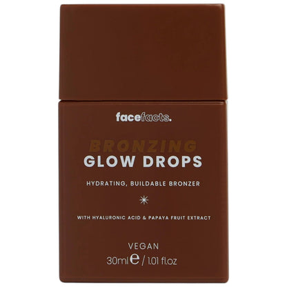 Face Facts Face Facts Bronzing Hydrating Buildable Bronzer Glow Drops in a clear bottle with a dropper, showing the liquid formula.