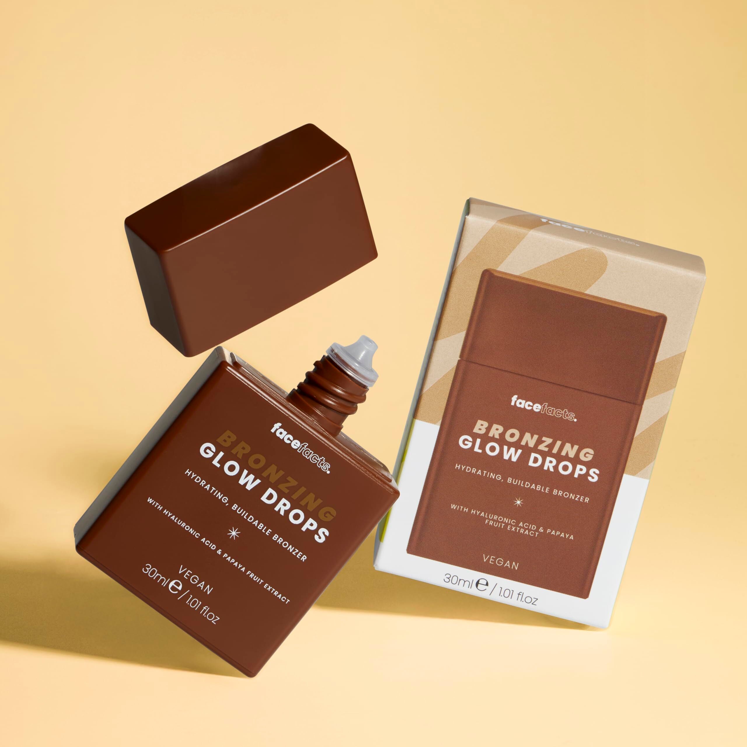 Face Facts Bronzing Hydrating Glow Drops in a clear bottle with a dropper, showcasing the buildable bronzer formula for luminous skin.