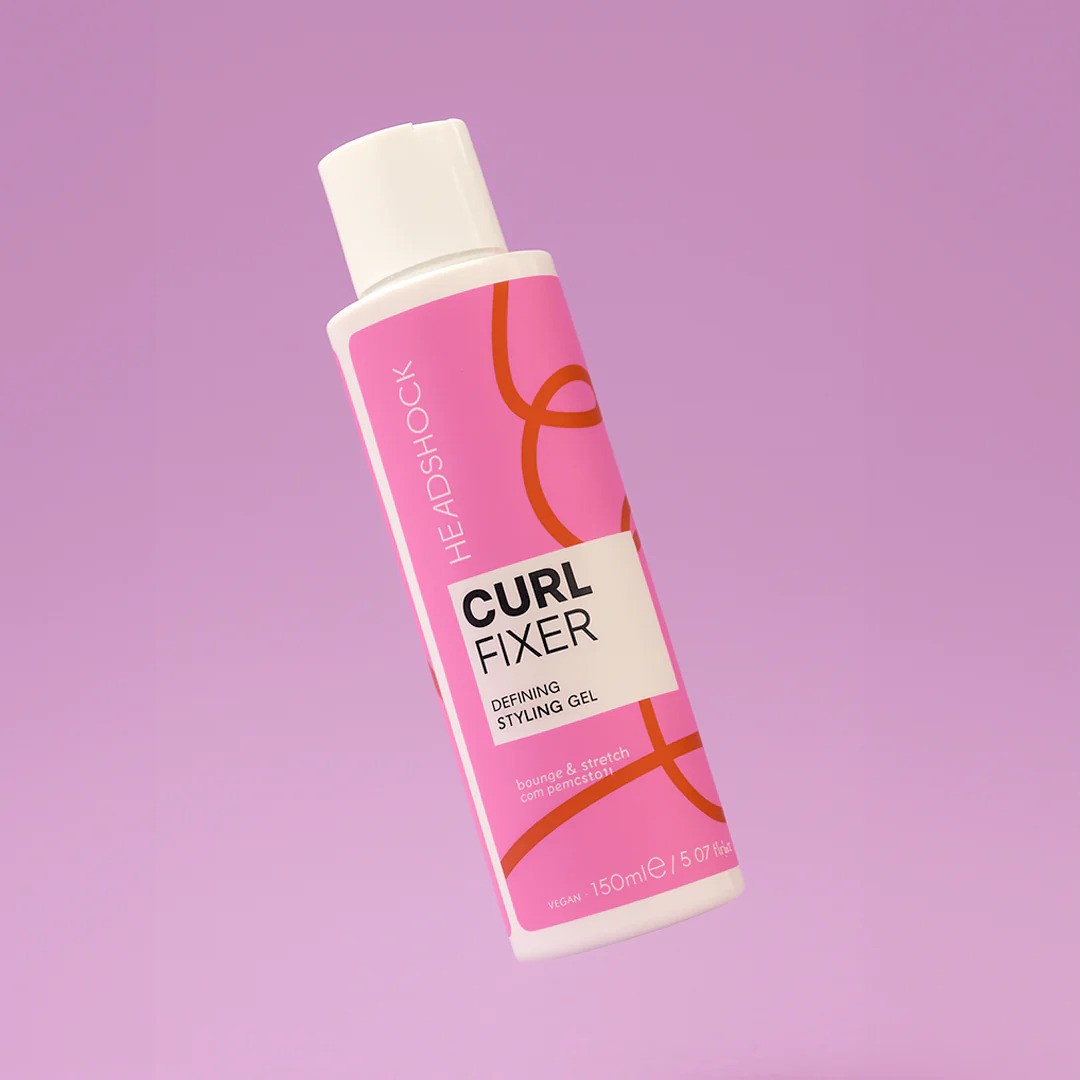 Face Facts Headshock Curl Fixer styling gel for defining curls, shown in a clear jar with product label visible.
