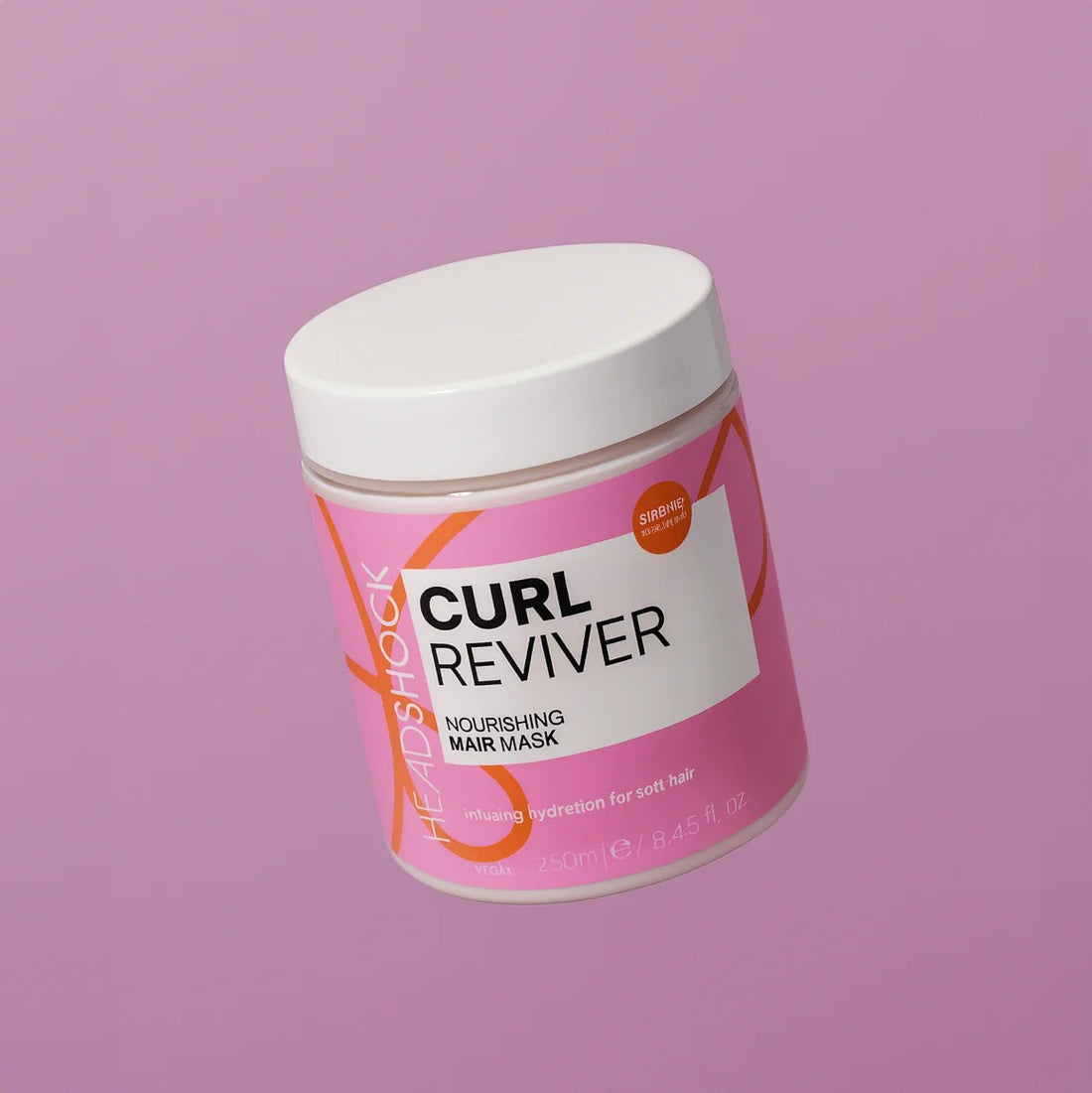 Face Facts Headshock Curl Reviver nourishing hair mask in a jar, designed to hydrate and define curly hair.