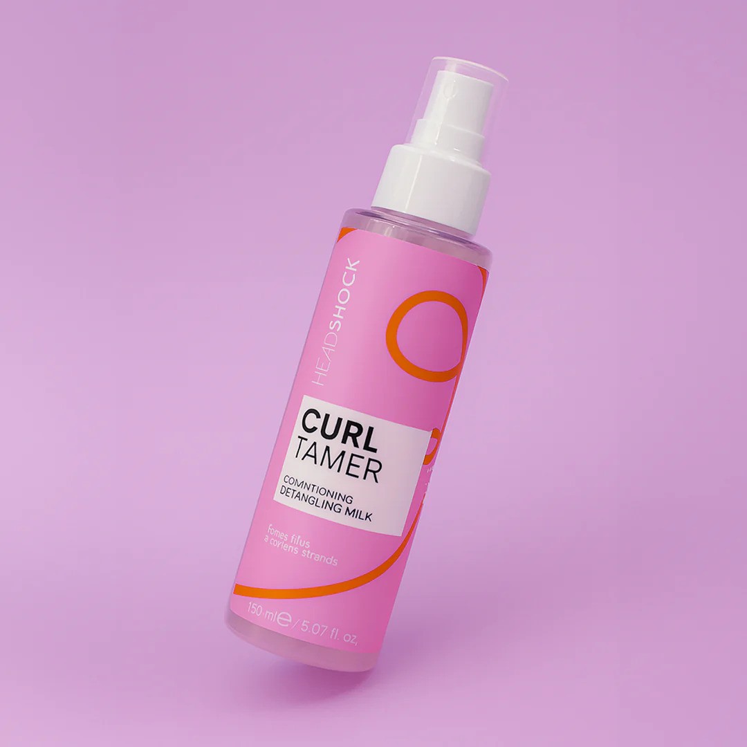 Face Facts Face Facts Headshock Curl Tamer Conditioner bottle with curl taming and detangling features for curly hair.