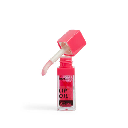 Face Facts Nourish Plus Renew Hydro Watermelon Pink Blush Lip Oil in a clear tube with pink tint and applicator brush.