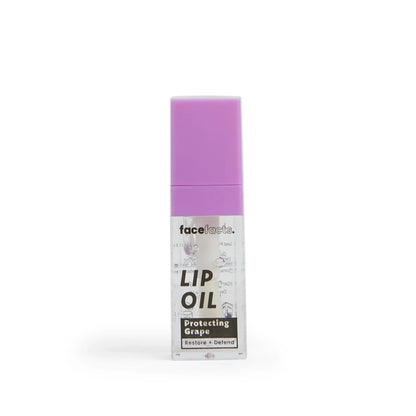 Face Facts Nourish Plus Renew Protecting Grape Clear Glaze Lip Oil in a sleek tube, showcasing a glossy finish and vibrant purple packaging.
