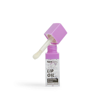 Face Facts Nourish Plus Renew Protecting Grape Clear Glaze Lip Oil in a transparent bottle with a white cap, highlighting its glossy finish.