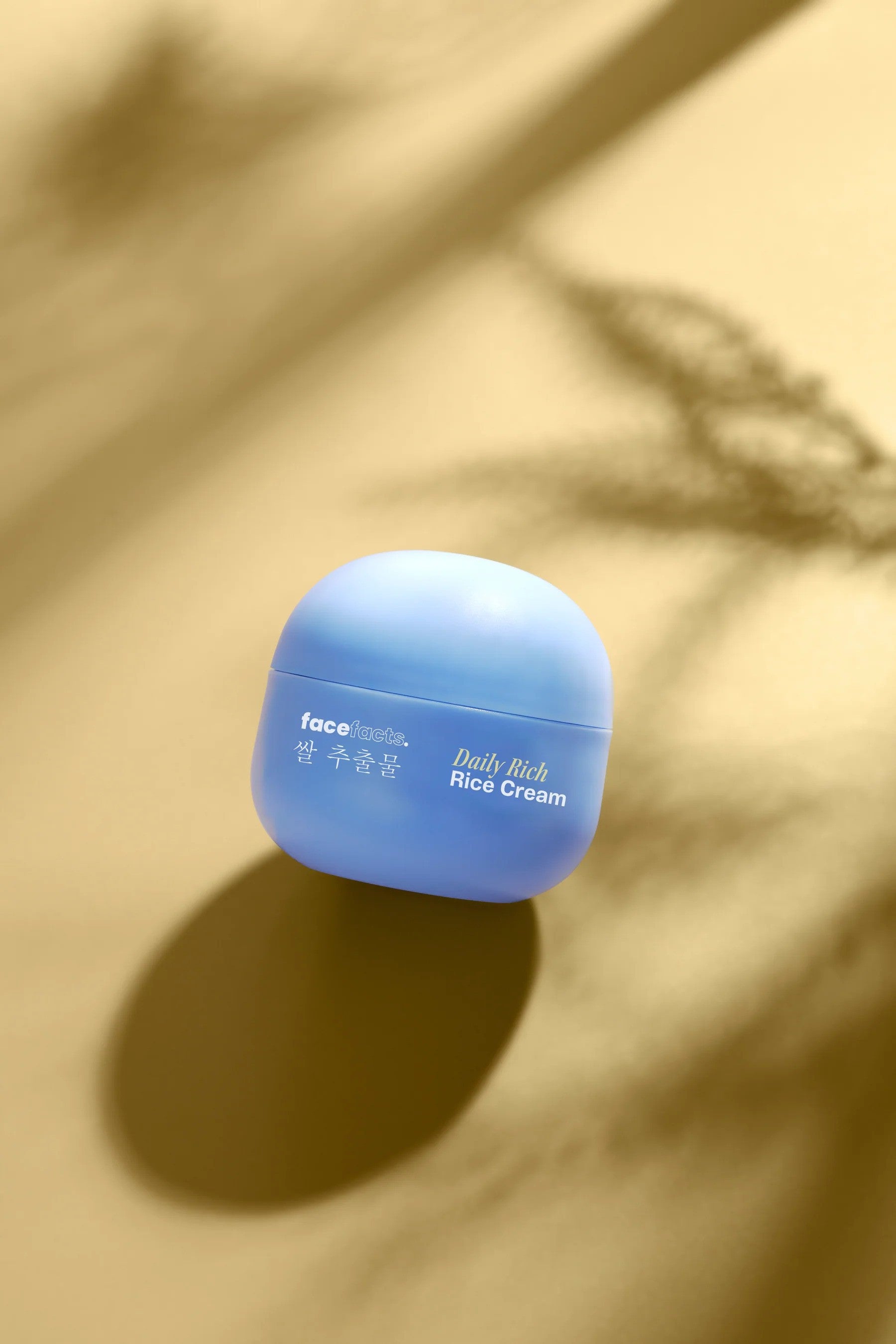 Face Facts Rice Extract Daily Rich Rice Cream moisturizer jar with white and pink packaging, designed for nourishing skin.