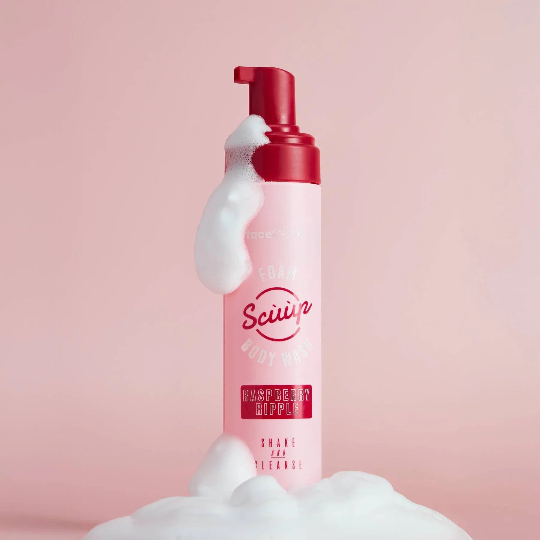 Face Facts Raspberry Ripple Foam Body Wash in a clear bottle, showing the pink and white swirl of the raspberry ripple scent.
