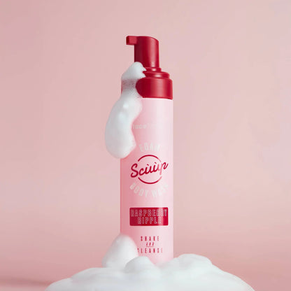 Face Facts Raspberry Ripple Foam Body Wash in a clear bottle, showing the pink and white swirl of the raspberry ripple scent.