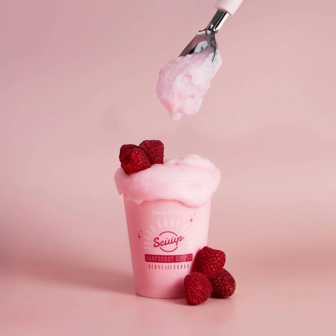 Face Facts Raspberry Ripple Sugar Body Scrub in a jar, showing the textured scrub with raspberry ripple scent for bath and shower use.