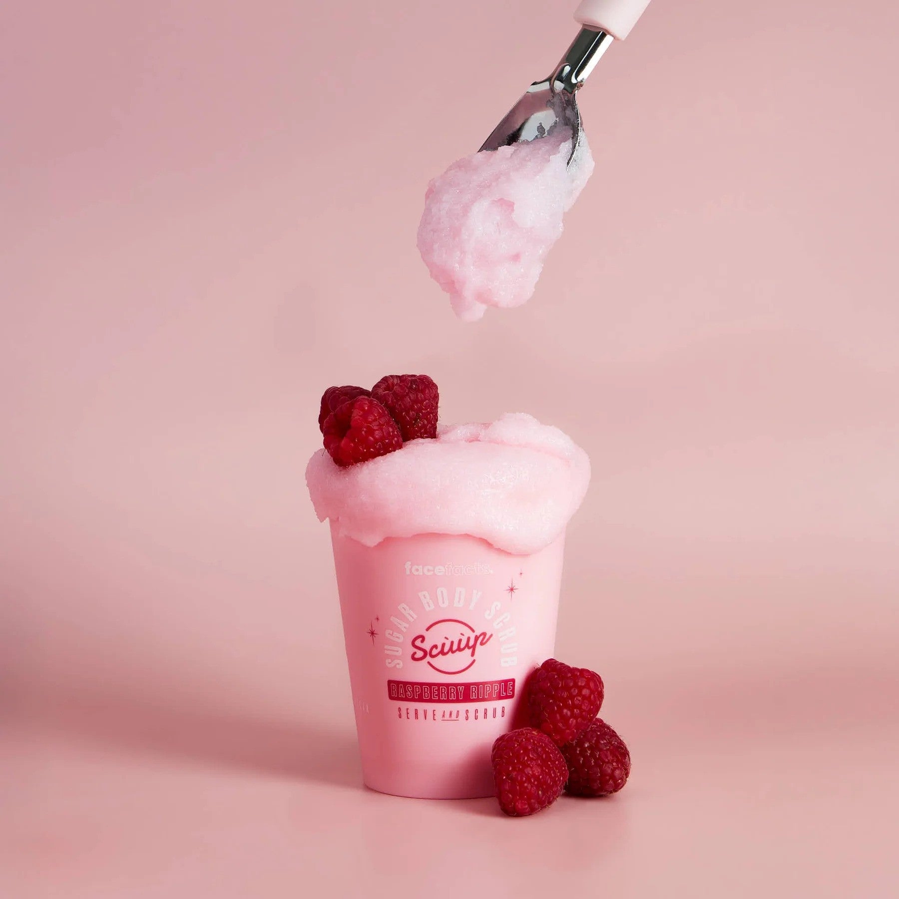 Face Facts Raspberry Ripple Sugar Body Scrub in a jar, showing the textured scrub with raspberry ripple scent for bath and shower use.