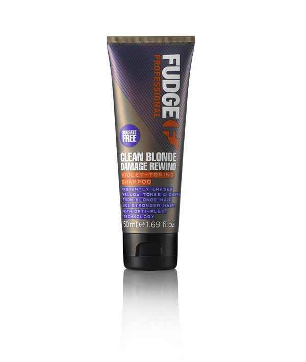 Fudge Clean Blonde Damage Rewind Violet Toning Shampoo bottle with purple liquid for blonde hair toning and damage repair.