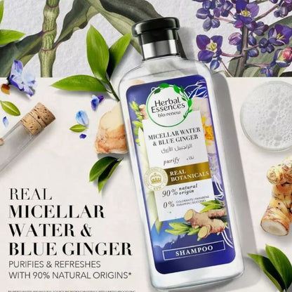 Herbal Essences blue ginger shampoo bottle next to micellar water bottle, showcasing the Herbal Essences hair care products.