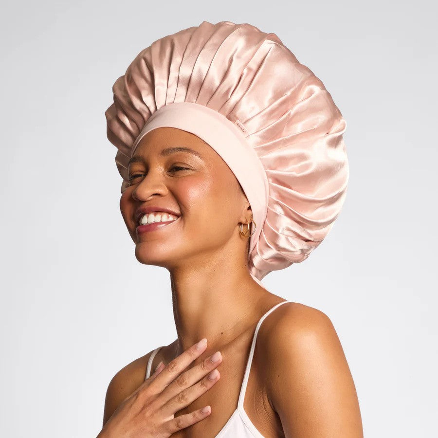 Kitsch oversized adjustable satin hair bonnet with soft fabric, designed to protect hair during sleep or styling.