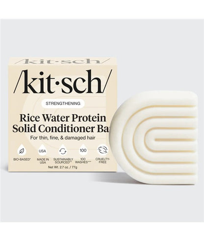 Kitsch rice water protein solid conditioner bar for strengthening hair, shown in a sleek, natural-colored bar shape.