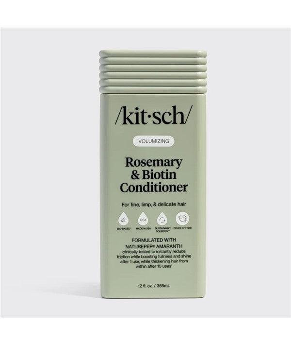 Kitsch volumizing rosemary and biotin conditioner bottle with label, featuring green and white packaging for healthy hair.