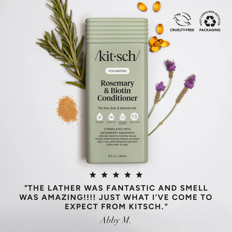 Kitsch volumizing rosemary and biotin conditioner bottle with herbal ingredients label on white background.