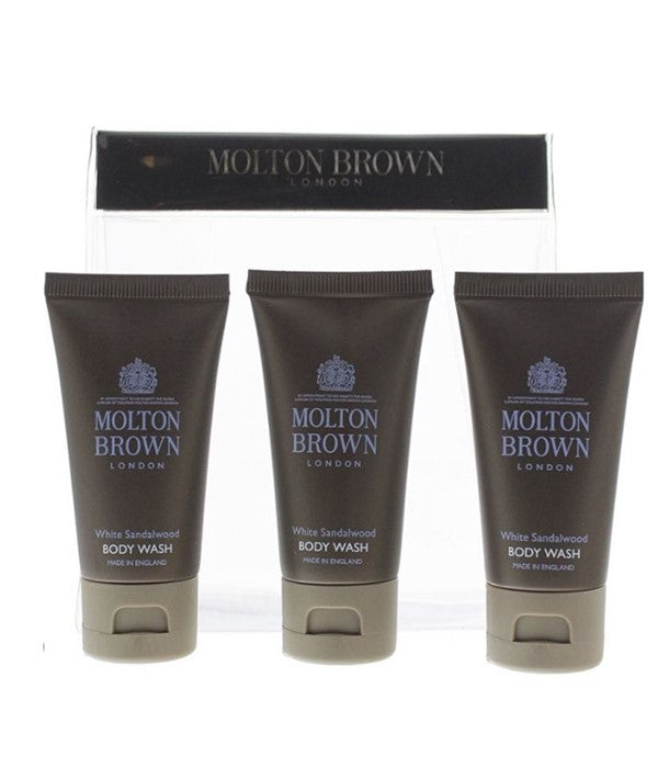 Set of three Molton Brown White Sandalwood Bath and Shower Body Wash bottles in a travel pack, featuring elegant white packaging.