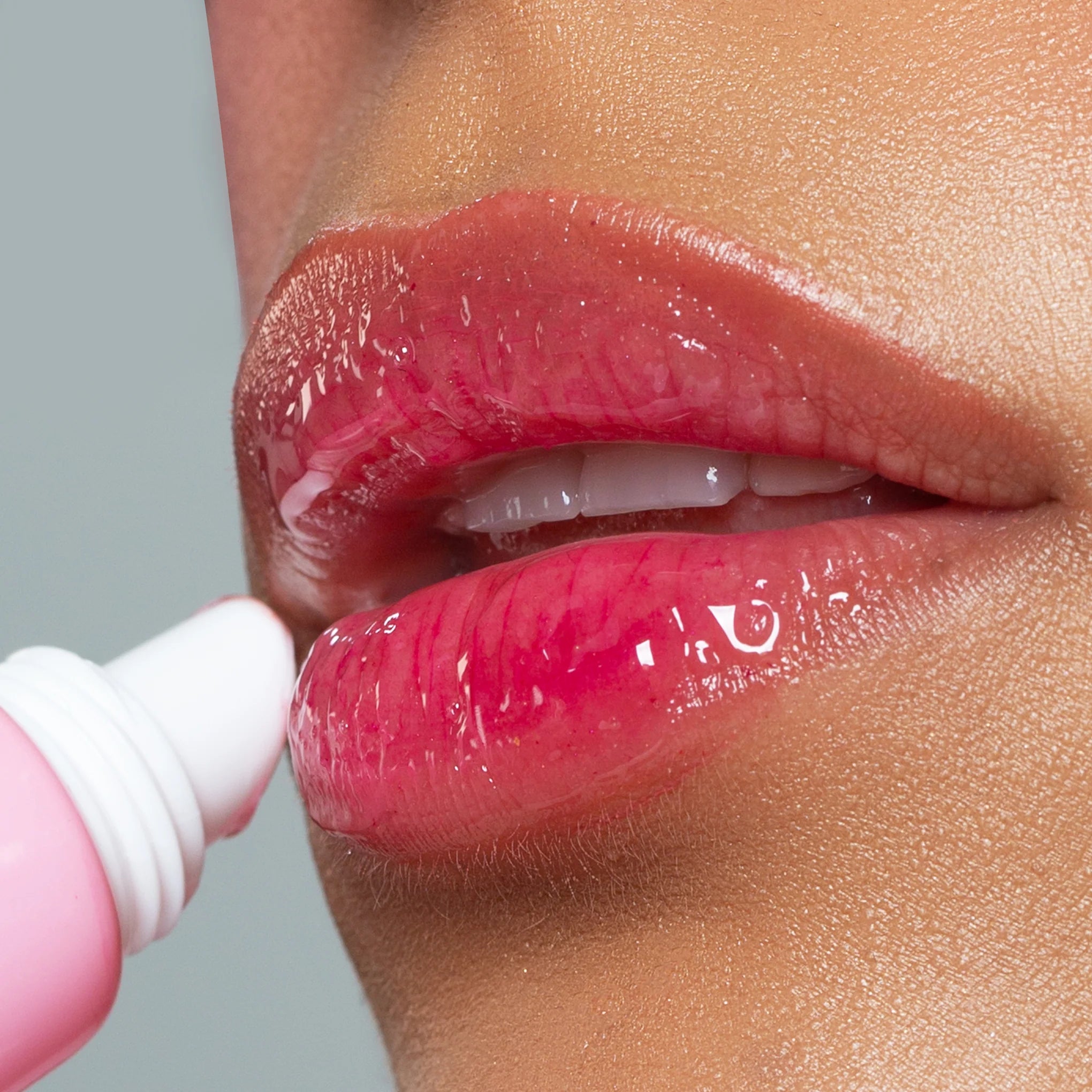 NICKA K NEWYORK Plum Ping Lip Gel in a clear jar, featuring a purple-colored lip care product with a smooth gel texture.