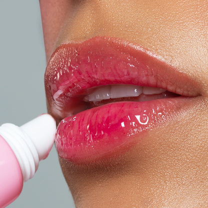 NICKA K NEWYORK Plum Ping Lip Gel in a clear jar, featuring a purple-colored lip care product with a smooth gel texture.