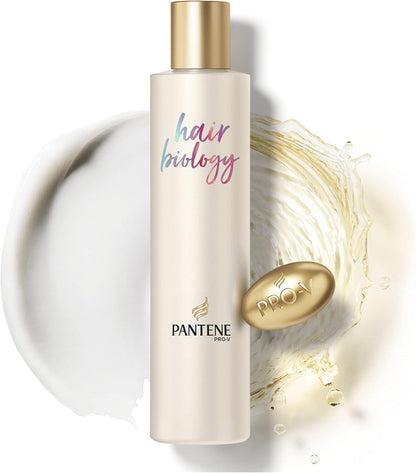 Pantene Hair Biology De Frizz and Illuminate Shampoo bottle with label, showcasing shiny hair and smooth, frizz-free hair care.