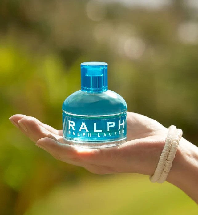Ralph Lauren Ralph Eau De Toilette for women, elegant glass bottle with floral accents, representing the For Her fragrance.