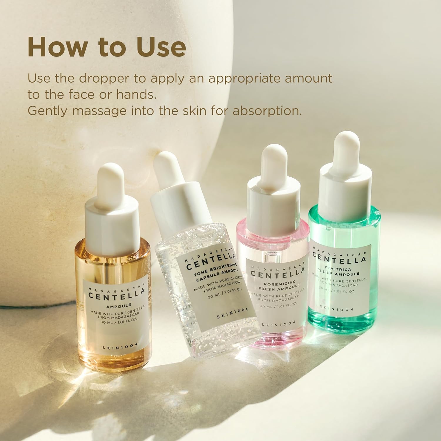 SKIN1004 Madagascar Centella Ampoule Kit featuring skincare ampoules, serum bottles, and natural ingredients for K-beauty skincare routines.