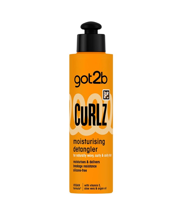Schwarzkopf Got2b Curlz Moisturising Detangler conditioner bottle with curly hair in the background.