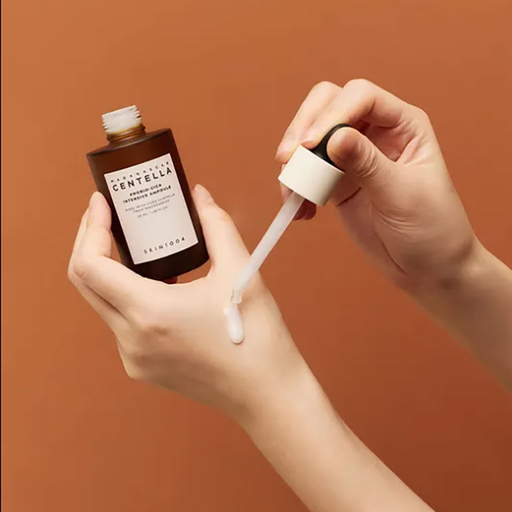 SKIN1004 Madagascar Centella Probio Cica Intensive Ampoule in a glass bottle, designed for deep moisturizing and soothing skin.