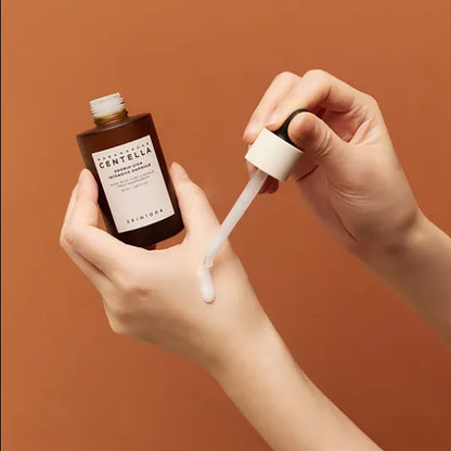 SKIN1004 Madagascar Centella Probio Cica Intensive Ampoule in a glass bottle, designed for deep moisturizing and soothing skin.