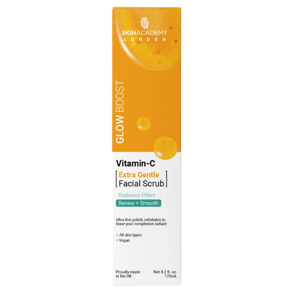 Skin Academy Glow Boost Vitamin C Facial Scrub in a 125ml tube, showing the gentle exfoliating texture and vibrant packaging.