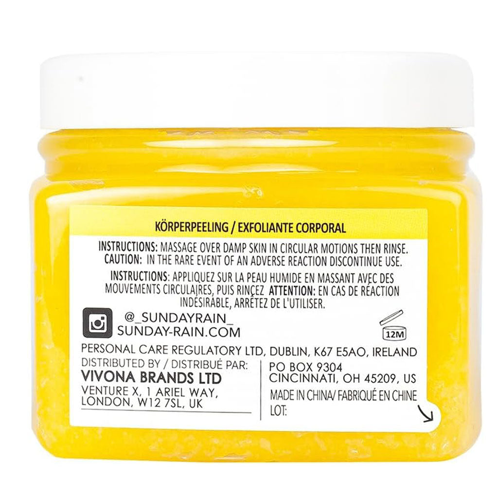 Sunday Rain Chamomile Ylang Ylang body scrub in a jar, featuring a creamy texture with chamomile and ylang ylang floral ingredients.