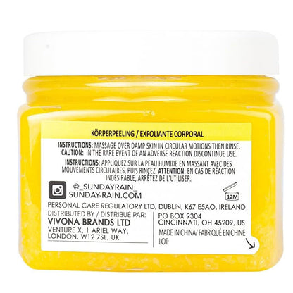 Sunday Rain Chamomile Ylang Ylang body scrub in a jar, featuring a creamy texture with chamomile and ylang ylang floral ingredients.