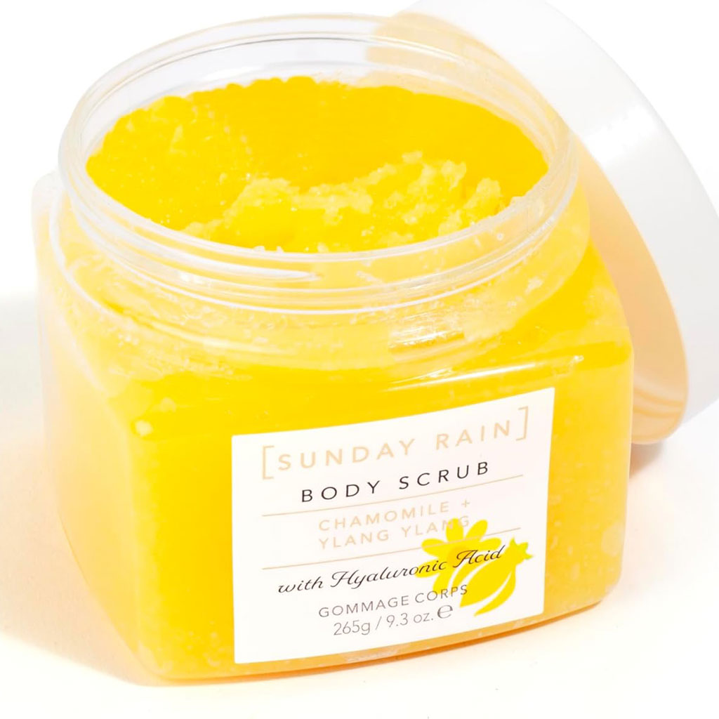 Sunday Rain chamomile and ylang ylang body scrub in a jar, perfect for bath and shower skincare, featuring natural floral ingredients.