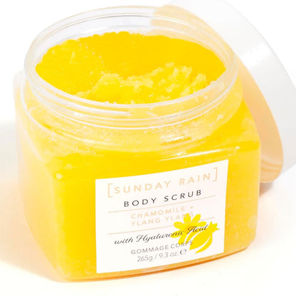 Sunday Rain chamomile and ylang ylang body scrub in a jar, perfect for bath and shower skincare, featuring natural floral ingredients.