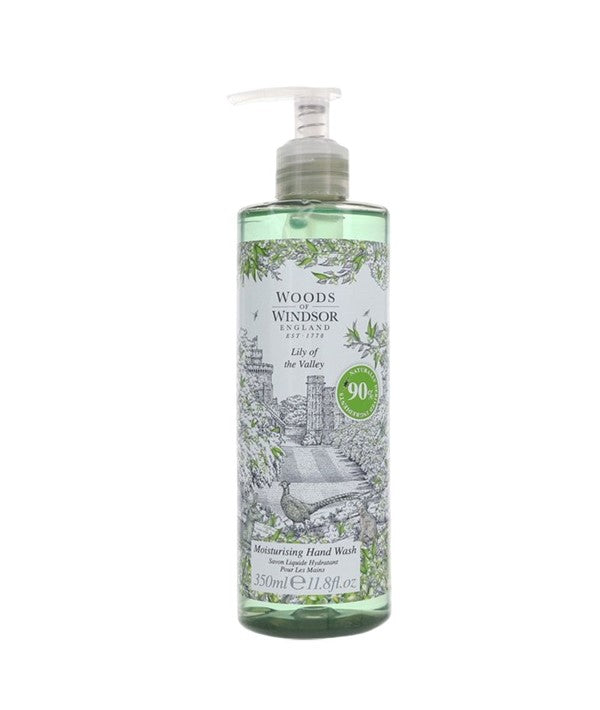 Woods Of Windsor Lily Of The Valley moisturizing hand wash in a clear pump bottle with floral label and white soap inside.