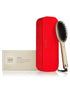 GHD Glide Smoothing Hot Brush in gold, a hair styling tool with a sleek design for smooth, shiny hair.